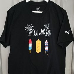 Puma Women's in (Large) 4th July shirt~"PUMA" in white with fireworks and a popsicle, hotdog, and firecracker.
