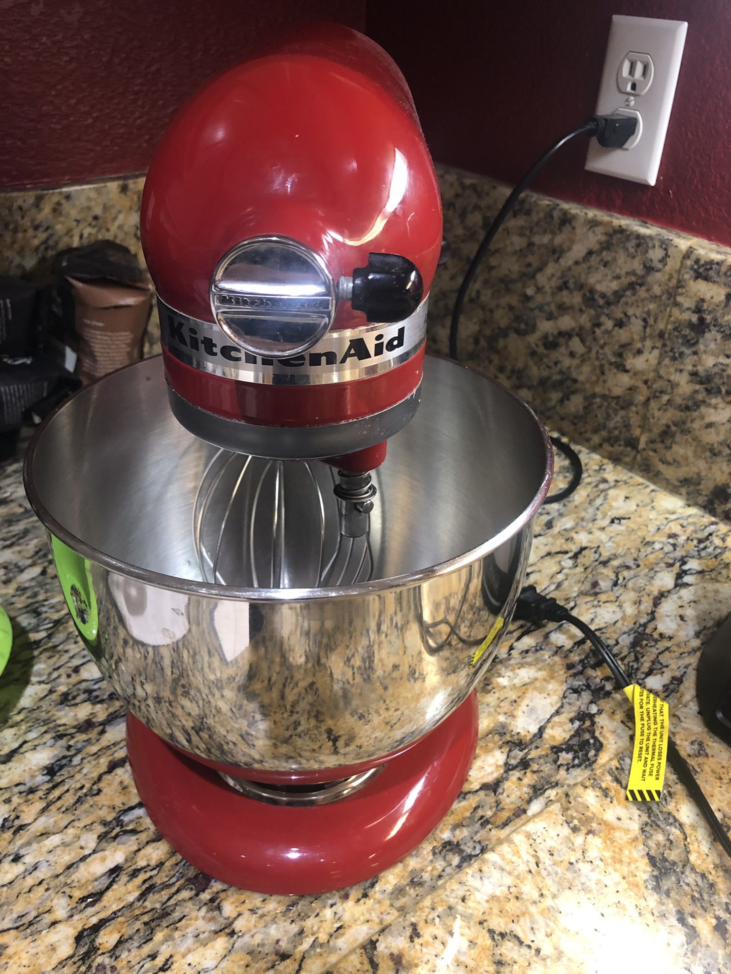 Kitchen Aid artisan series . 5 quart. tilt head stand mixer in red.10 speeds. Comes with the 2 attachments.