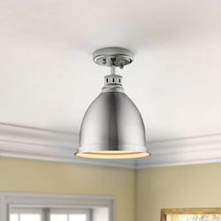 {ONE} Drakeford light. Finish: pewter with pewter shade. Dimmable. Fixture: 8.88” D. MSRP: $158. Our price: $64 + Sales tax 