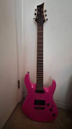 Mitchell bright pink electric guitar