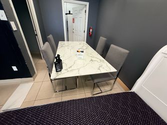 Marble top dining table with four chairs brand new