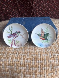 Vintage pair of small hand painted plates