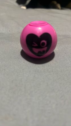 Pink smiley face fidget spinner