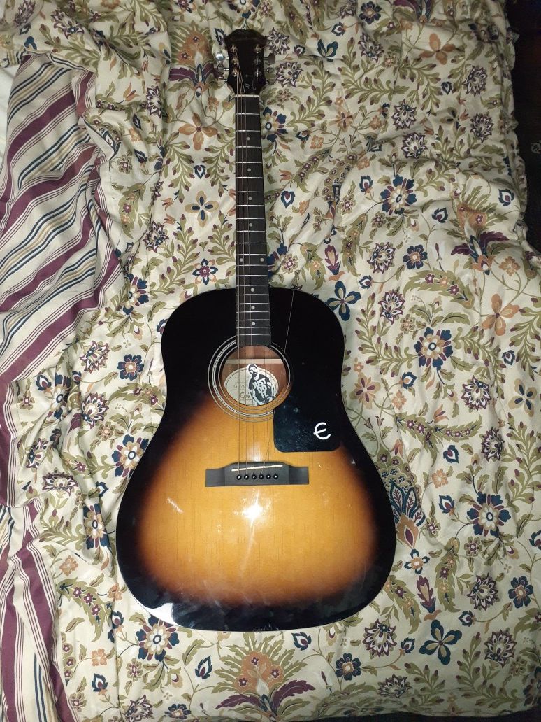 Epiphone acoustic guitar with pack of strings