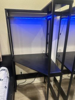 Corner desk with LED lights and outlets and usb ports