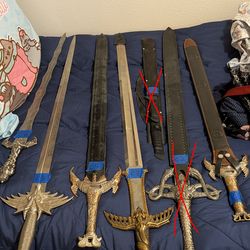 Lot of decorative swords, military sabers and katana's