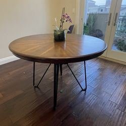 Circular dining table