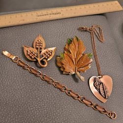 Copper Chain, Pendant, Two Brooches, and a Bracelet 