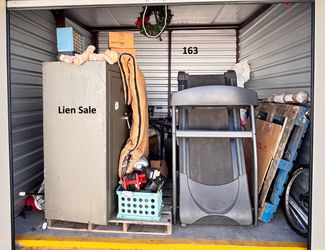 Lien Auction Unit 163 3/26 - Safe, Treadmill, Bike, Tools, Mixed Storage