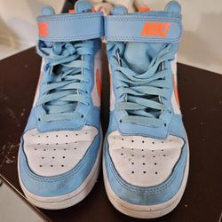 Nike.  (Lt Blue, White, Orange)