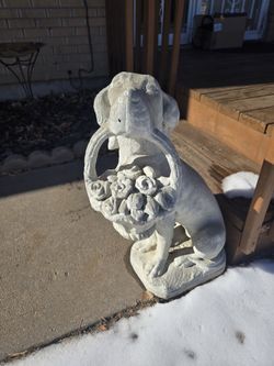 Concrete Dog Holding Basket of Flowers