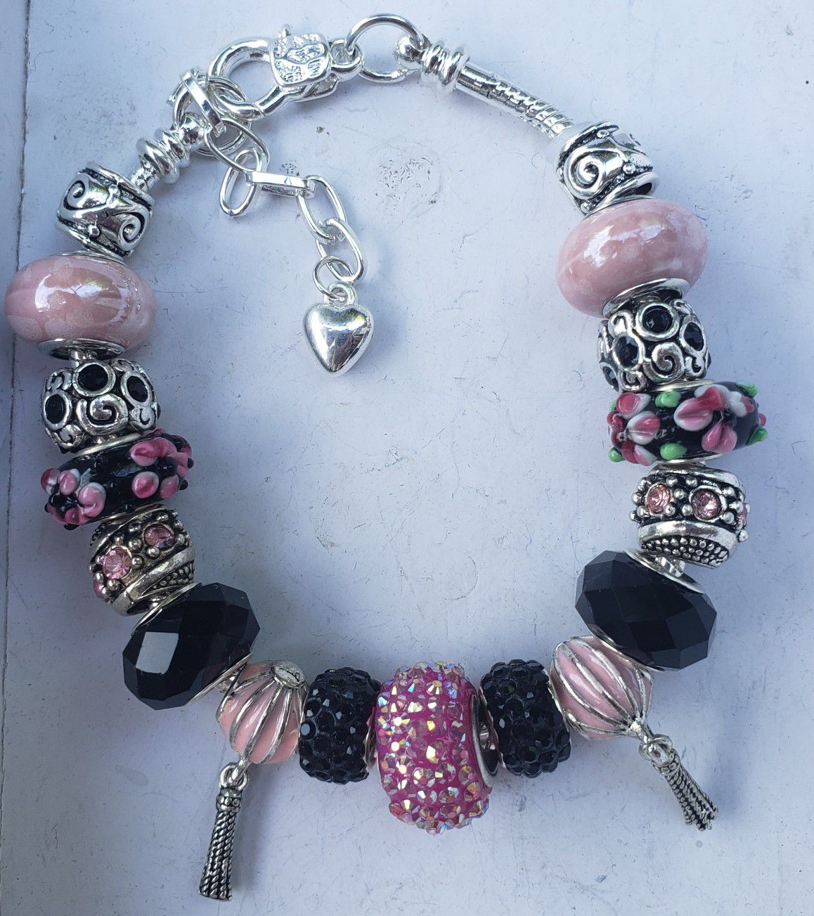 Pink and black charm bracelet 1 for $15 or 2 for $25