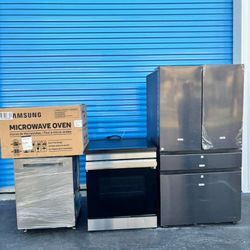 Full kitchen set combo: Samsung Bespoke stove inductiomicrowave, dishwasher, and 4-door refrigerator