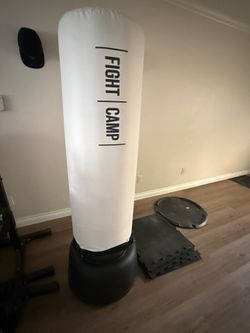 Fight camp floor mounted heavy bag with gym flooring