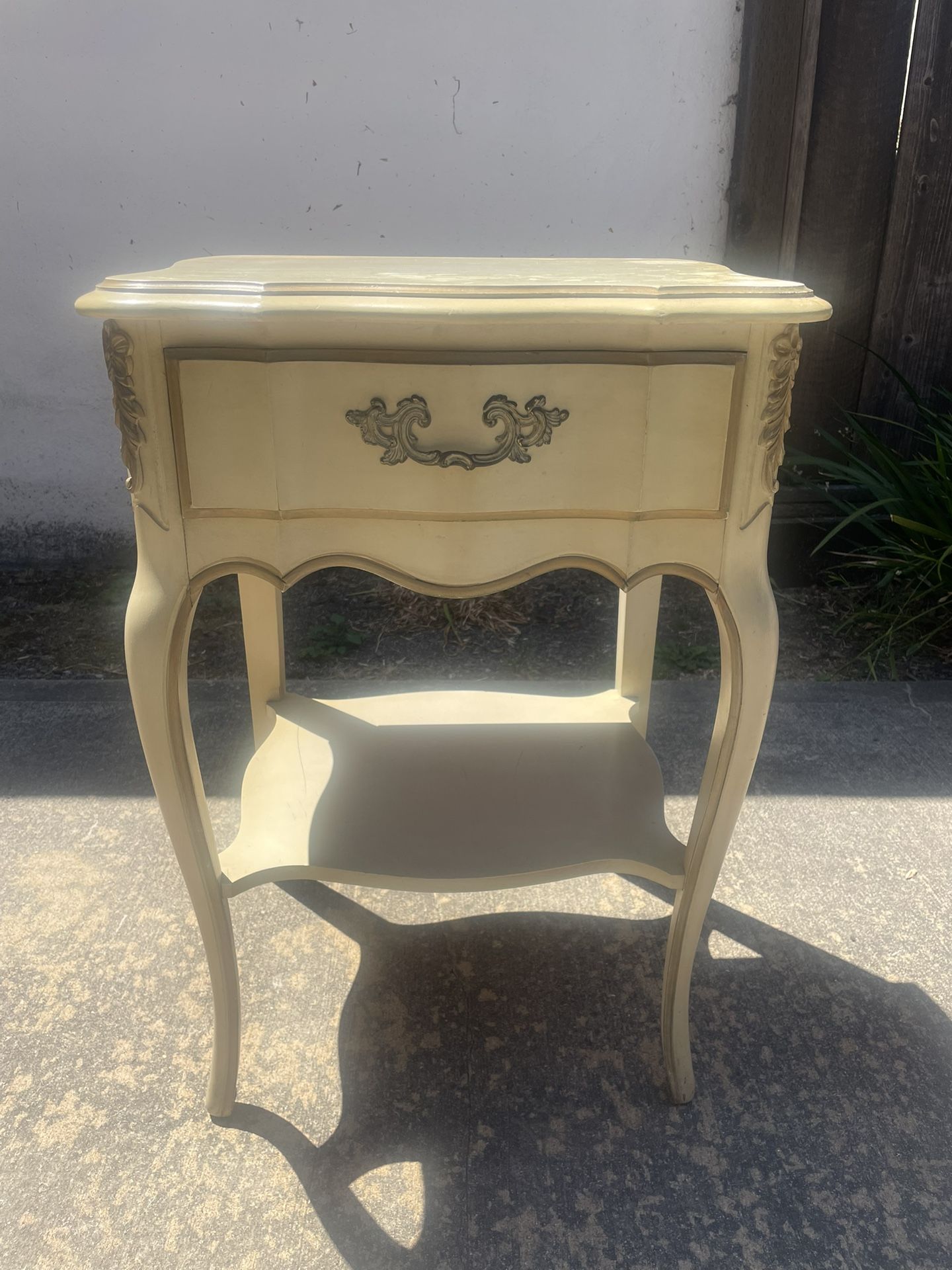 Antique cream-colored side table