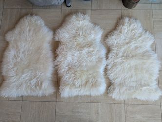 Three Small Lambskin Rugs