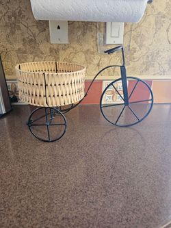 Decorative ivy plant in bicycle planter