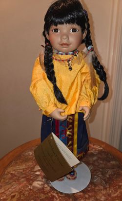 "Golden Flower" porcelain doll from the Georgetown Collection, specifically designed by artist Carol Theroux.