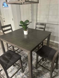 Used Gray Bridson Counter Height Dining Table and 4 Bar Stools