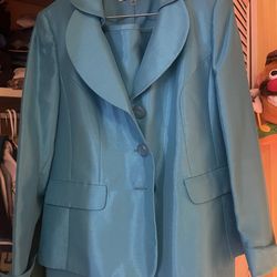 LeSuit brand blue skirt suit featuring a blazer with collar and button closure