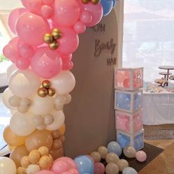 Decoración para revelación de de sexo en 3 tonalidades con centros de mesa.