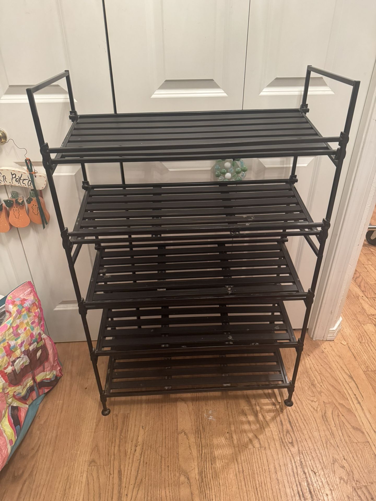 Black metal shoe rack