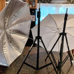 2 CAMERA TRIPODS WITH LIGHTING UMBRELLAS