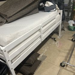 White twin platform bed with two twin mattresses