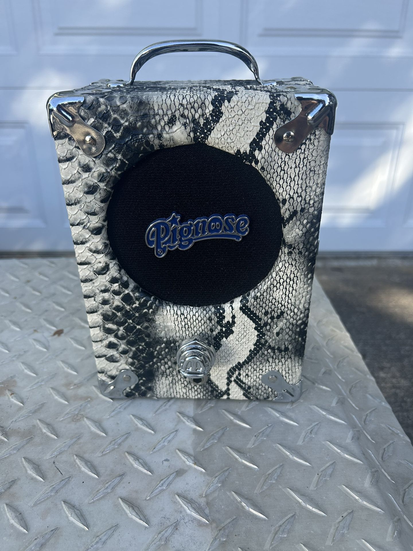 Pignose guitar amp, limited edition portable in excellent shape. Used very little, comes with electrical adapter. Can also run on AA batteries. $80,