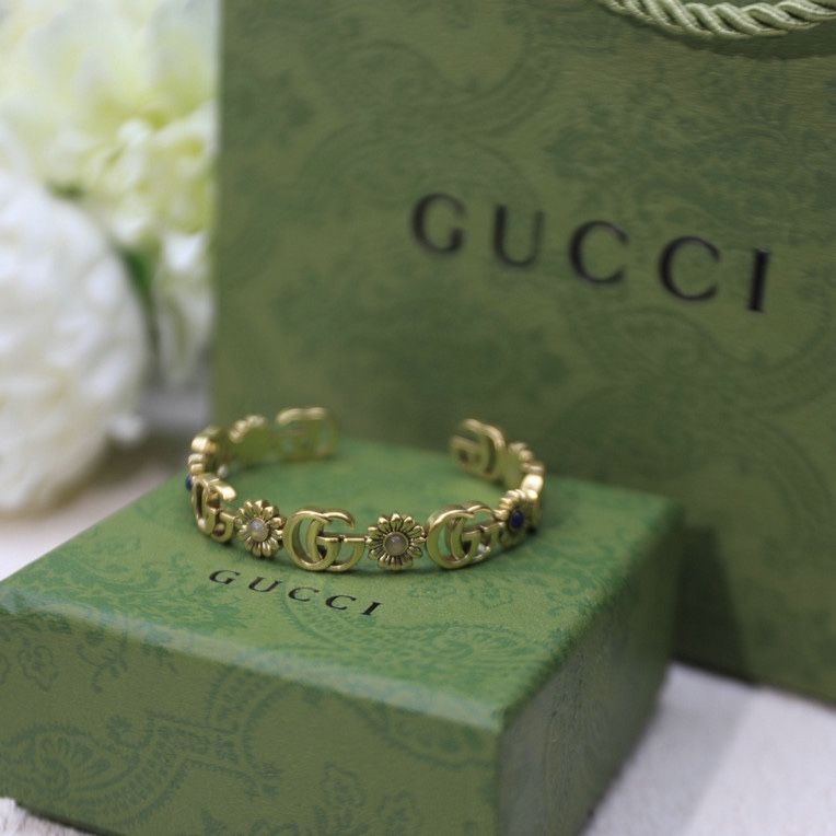 GG Logo With Flower Design Blue Stone Gold Bracelet