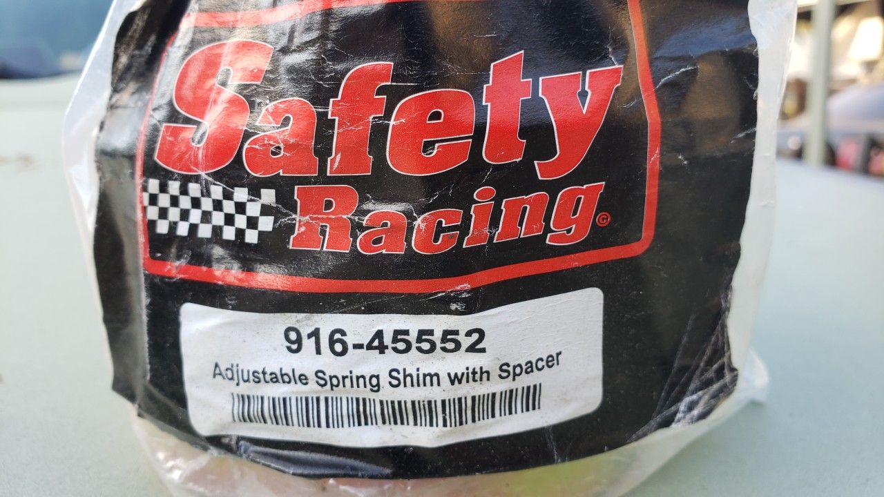 Adjustable spring perch spring spacer