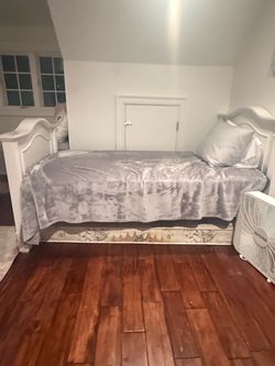 Two white twin beds