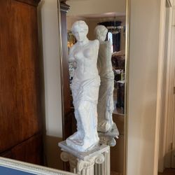 Goddess of love statue she’s 3 1/2 feet car sitting on a 2 1/2 foot tall Pedestal with Marble