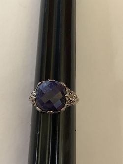 Open work sterling silver ring with a dark purple- blue faceted stone size 8