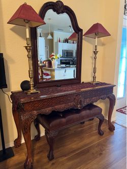 Vanity with mirror and ottoman and lamps