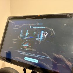 Peloton bike - like new. 10 rides total + shoes + mat
