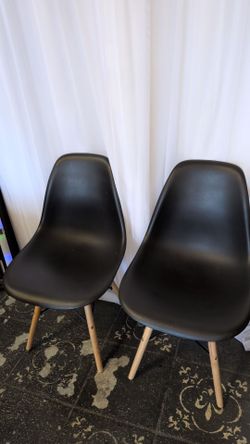 Black modern chairs with wooden legs