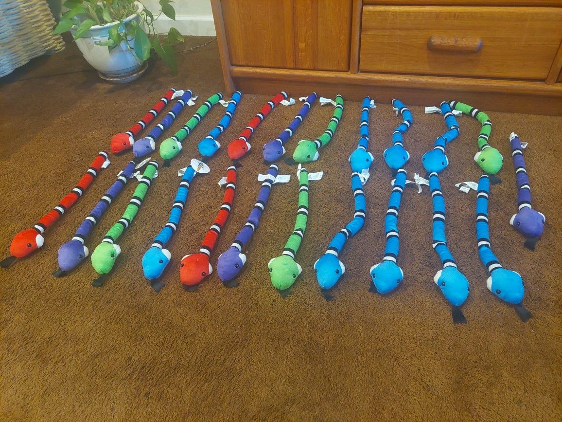 Collection of brightly colored plush snakes
23 Pieces 