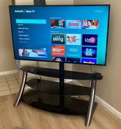 65” Roku Smart TV with Glass & Metal Television Stand Original box