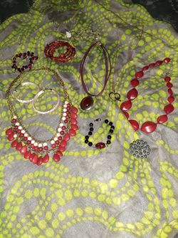 4 necklaces 3 bracelets, brooch, and earrings