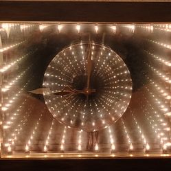 Beautiful Vintage 1970s Infinity Wall Mirror Clock model 533 see our other great vintage antiques furniture art jewelry sports collectibles now posted