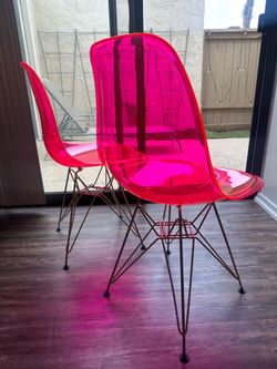 Pink acrylic chairs