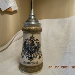 Very RARE Deutschland Lidded Beer Stein w/a figure of an Alpine hiker on the handle.