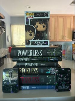 Powerless book set and Funko