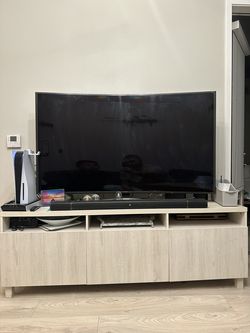 64 inch Samsung TV and a stand for