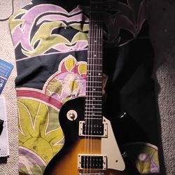Used Epiphone Les Paul 100. Sunburst. Great intro level guitar.
