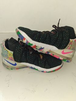 Nike LeBron 18 "James Gang" sneakers feature a black knit upper with a vibrant, multicolored graphic on the heel and sole.The design includes pink bla