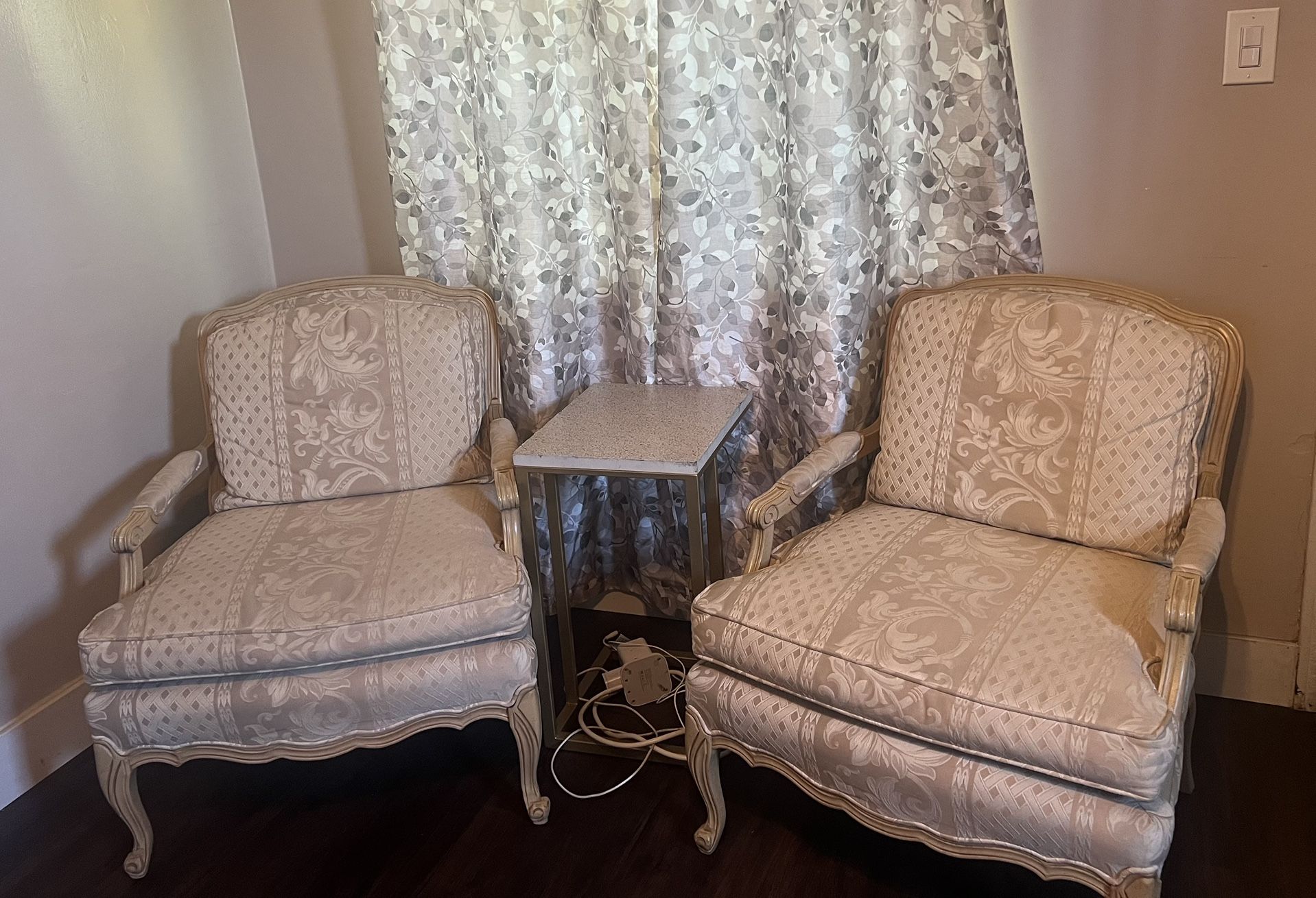 Louis XV style armchairs with cabriole legs and floral jacquard upholstery.