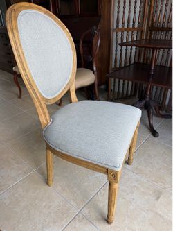 Light grey upholstered French country-style dining Chairs