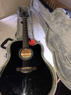 Takamine G series with hard case.